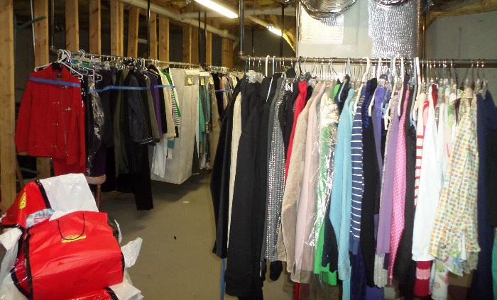 a few of the racks in the basement of women's clothing