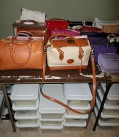 loads of purses & the boxes below the table are all shoes