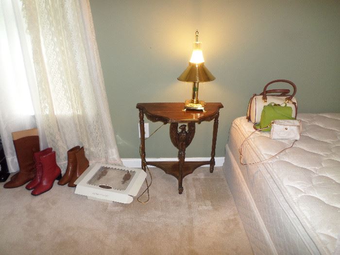 some of the nice pairs of boots, cute small table, mattress/boxsprings