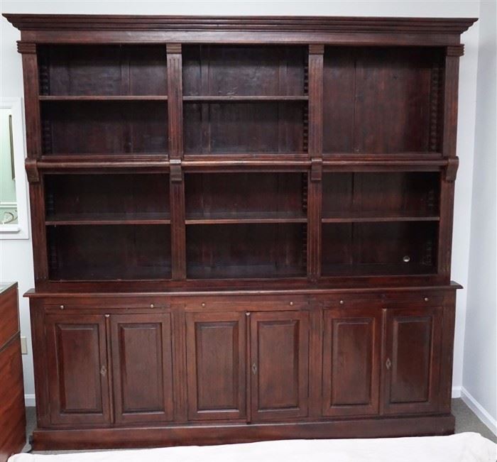 Classic Substantial Library Wall Unit with Ladder. The unit comes equipped with ladder rails and ladder and offers six doors of closed storage, 3 pull out desk top space and adjustable open shelfs. In a dark mahogany finish, Measures 96"x18.50"x96". 