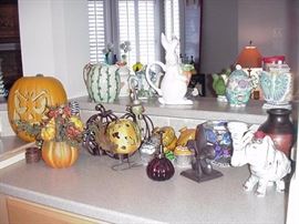 Halloween decorations, fall pumpkins;  bunnies, watermelon theme for summer; many other decorative teapots, pitchers, and vases
