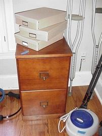 One of two wood file cabinets