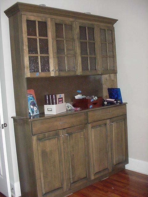 Huge lighted cabinet with space above for glassware and below for much, much more
