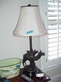 One of a pair of decorative lamps, camel theme