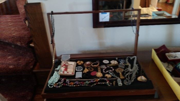 Costume jewelry, lighters, vintage holiday postcards and more smalls.