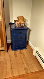 Cabinet painted blue and Longaberger baskets.