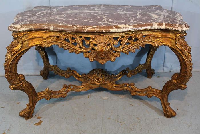 36 - Massive gold gilded French center table with brown and white heavy thick marble, turtle top, 35 in. T, 58 in. W, 35 in. D.