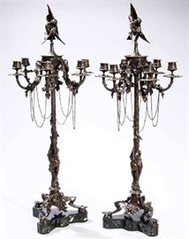88 - Pair of Extraordinary Large 19th Century Bronze Candelabras by Auguste Nicholas Cain
(1824-1894) Very Ornate with Bird , Leaf, Scroll & Chain Decorations ending in Claw Legs on Multi-Colored Marble Bases, Signed in 3 places and dated 1869.
Nicholas Cain was known for Sculpture and Animalier Bronzes. 34 in. T