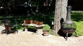 Assorted pots, fire pit, and other outdoor items are in the sale.