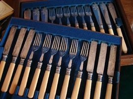 Boxed set of fruit knives and forks and fish knives and forks.