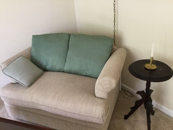 loveseat and small round side table