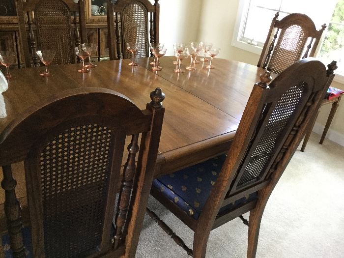 matching dining table and cane back chairs