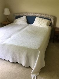 king bed and upholstered headboard