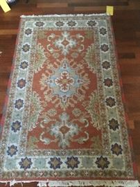 beautiful rust colors in this small hand done rug.