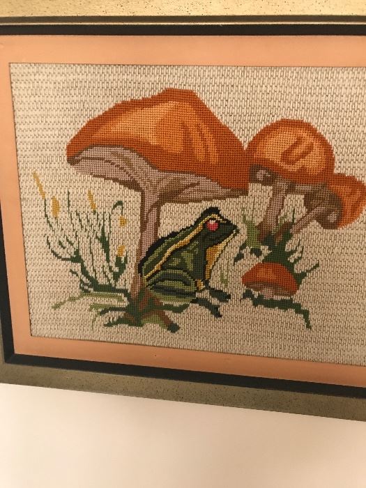 great needlework of a frog under some fun and funky mushrooms framed