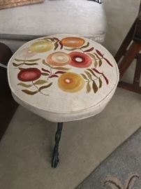 how about an antique stool with a vintage crewel work top