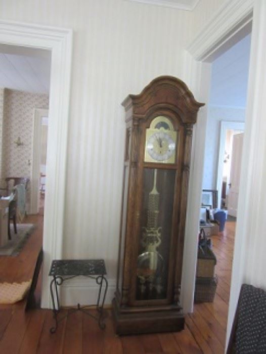 Miller tall case clock.  Cast iron table next to it.  The clock is in perfect condition. 