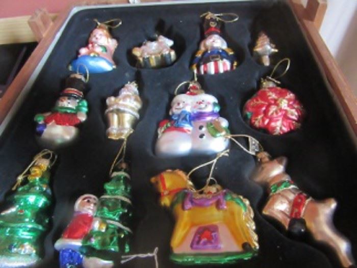 Blown glass ornaments. There are two or three boxes of blown ornaments.  There is a box of Santas, a box of  bears, and box lots with Nutcrackers.  