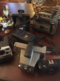 large collection of polaroid cameras