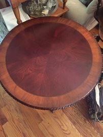 round mahogany table with carved legs