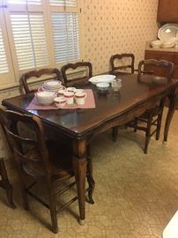 Rectangle dining table.  Expands by pulling out end pieces.  6 chairs