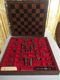 Chess set with brass pieces and leather board
