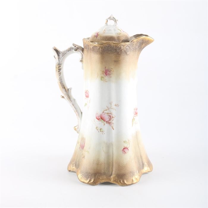 Warwick China Chocolate Pot: A Warwick China chocolate pot. The tall hot chocolate server features a scalloped rim and base with sculpted sides. The chocolate pot has a rose pattern with gilt verge and trim and is stamped on the underside.