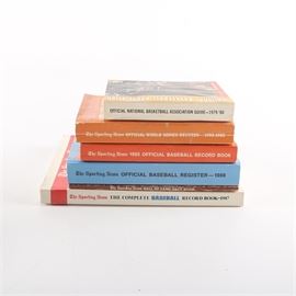 1970s-1980s "The Sporting News" Record Books: An assortment of 1970s-1980s The Sporting News record books. This assortment features six paperback books publishing by The Sporting News of St. Louis, Missouri. The books include National Basketball Association Official Guide for 1979-80 edited by Matt Winick, Official World Series Records: 1983 Editon edited by Craig Carter, Official Baseball Record Book: 1985 Edition edited by Craig Carter, Official Baseball Register: 1988 Edition edited by Barry Siegel, Hall of Fame Fact Book: 1982 Edition edited by Paul Mac Farlane and The Complete Baseball Record Book: 1987 Edition edited by Craig Carter.