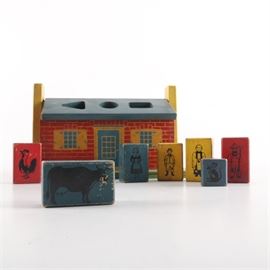 Vintage Holgate Educational Block Toy Set: A set of vintage educational wooden block toys by Holgate. This selection includes a block house with different cut out shapes on the removable roof. The house comes with four rectangular shaped blocks with human figures, a red rectangular block with a rooster, a blue rectangular block with a cow, and a triangular shaped block with a mouse. These pieces date to around the 1950s.
