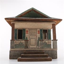Vintage Wooden Doll House: A vintage wooden doll house. This piece features hinges to open the house at various parts. There is a removable fireplace and unattached stairs, which lead up to the porch.