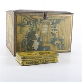 Pair of Vintage Tins Including Canco: A pair of vintage tins. The smaller rectangular yellow tin is marked “Rich’s Crystallized Canton Ginger – Manufactured By E.C. Rich, Inc. New York”. The Canco bread box tin, made by the American Can Company from the 1920s to the 1940s, has scenes from women in kitchens around the world. These depictions on the panels include “Early New England”, “Acadian”, “French”, and “Spanish”; the top lid has an illustration titled “Dutch Kitchen”. The hinged top has a clasped closure. To find out more about the “Rich’s” tin please see the link in the additional information below.