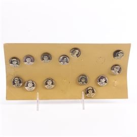 Collection of Antique Baseball Pins: A collection of antique baseball pins. This collection is part of the 1910-12 Sweet Caparol Pins set and features thirteen pins and includes such players as Christy Mathewson, John McGraw, Larry Doyle and more. The pinks are stuck into a cardboard sheet.