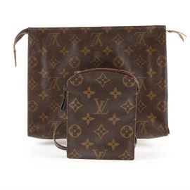 1980s Louis Vuitton Monogram Canvas Accessories: A pair of circa 1980s Louis Vuitton accessories bags. This grouping includes an accessories bag with a zippered top, interior branding, and an 822 date code. A smaller pochette featuring a long shoulder strap with interior branding and a stamped date code of 872AN completes the listing.