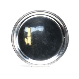 Gorham "Puritan" Sterling Silver Serving Tray: A sterling silver serving tray by Gorham. This piece features a round shape. It is stamped with the Gorham 20th century hallmarks alongside “Gorham Sterling 607”. The approximate weight is 12.630 ozt.