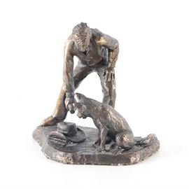 Holan Australia Bronze Sculpture: A cast bronze sculpture by Holan Australia. This work depicts a man using the top of his Stetson as a bowl to fill and help a dog that is sitting near him. The piece is marked “Holan Austrailia” to the underside.