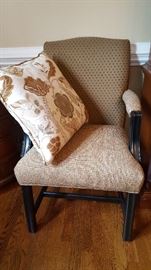 One of two chairs and coordinating pillows in a perfect neutral shade to compliment your home.