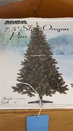 several Christmas trees ~ some in the box ready to go 