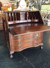 Beautiful antique mahogany secretary, with curved front drawers, unusual "stow away" compartments and has the original key! Neat piece! Excellent Condition! $315.00