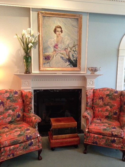 Two wingback chairs upholstered with Asian print fabric; book stack side table; 