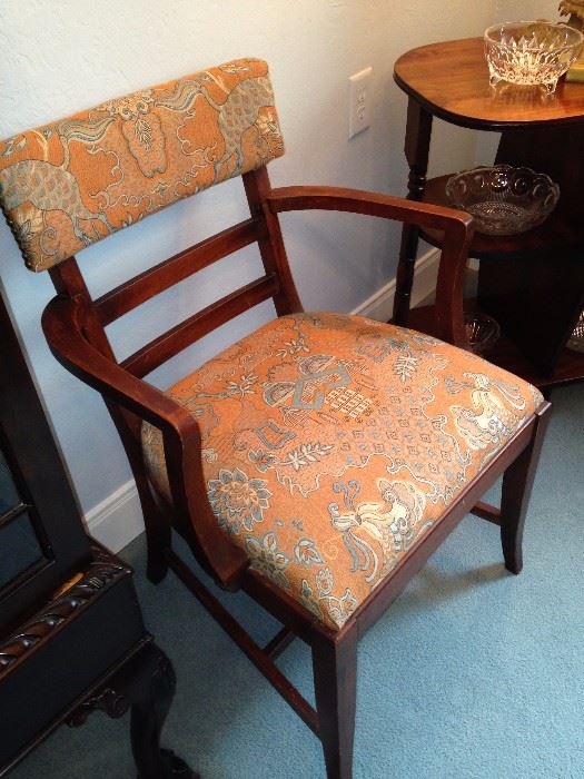 One of the dining table upholstered chairs