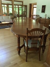 Richardson Bros. oak dining table with all 12 leaves extended to 16 feet
