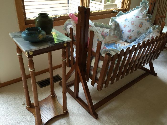 Antique cradle, marble top stand, Roseville and art pottery
