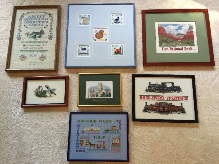 Some examples of framed cross stitch pieces by Martha Hicks