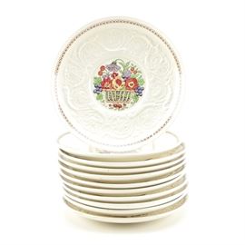 Wedgwood Patrician "Windermere" Plates: A collection of Wedgwood Patrician Windermere plates. Each plate features a painted design of fruit and flowers at the center surrounded by an ornate relief design and a thin painted geometric border. The underside of one plate is marked “Windermere Made in England Wedgwood Patrician U. S. A. Des. Patent 7851”, along with impressed marks reading “Made in England”, “Wedgwood” and “6235” and a handwritten mark reading “AK 786B J”.