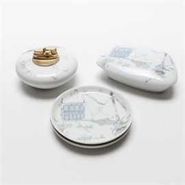 Rosenthal "Plaza" for Ronson: A selection of four Rosenthal Plaza china accents. Included are two saucers, a small lidded box, and a table lighter. Each is a white form with blue depictions of a plaza with buildings, pillars, and small figures.