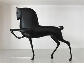 Stylized sculpted metal horse 