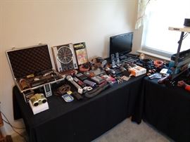 Some of our media collection, includes cameras and hardware, audio , portable cassette radio combos, SD Memory cards, most new in package, cords , cables and more.