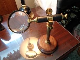 Vintage magnifier with wooden base, great quality glass with brass frame and accents on wooden base, perfect for stamp and/or coin collectors, or perhaps when one misplaces their glasses....