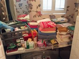 Main floor bath - towels, hand towels, & washcloths with misc items