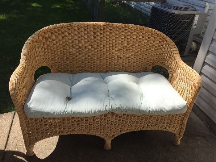 Wicker Love seat with cushions, indoors or out this is a great addition to any home